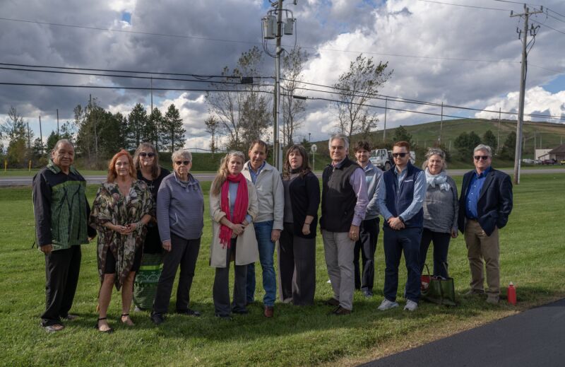 Sachem Sam George of the Gayogohó:nǫ (Cayuga) Nation; Yvonne Taylor, Co-Founder and Vice President of Seneca Lake Guardian; Debbie George, wife of Chief Sam George; Beth Gallagher, Assemblymember Emily Gallagher’s mother; Assemblymember Anna Kelles; Doug Avery, former Member of the Seneca Falls Town Board; Assemblymember Emily Gallagher; Assemblymember Al Stirpe; Jackson Marko, Legislative Coordinator; Mark Pitifer, Marketing & Communications Administrator, Government & Public Relations at Waterloo Container; Rebecca Martin, New York River Watch; Joseph Campbell, Co-Founder and President of Seneca Lake Guardian. Seneca Meadows is the large hill on the right.